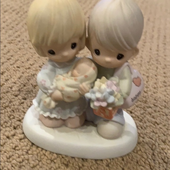 Precious moments blessed with a miracle figurine